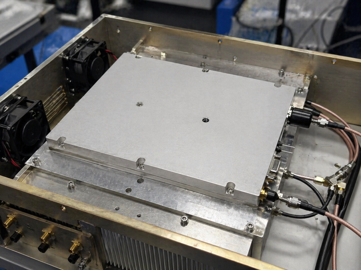Chassis-integrated RF amplifier system with visible RF connectors and cable routing