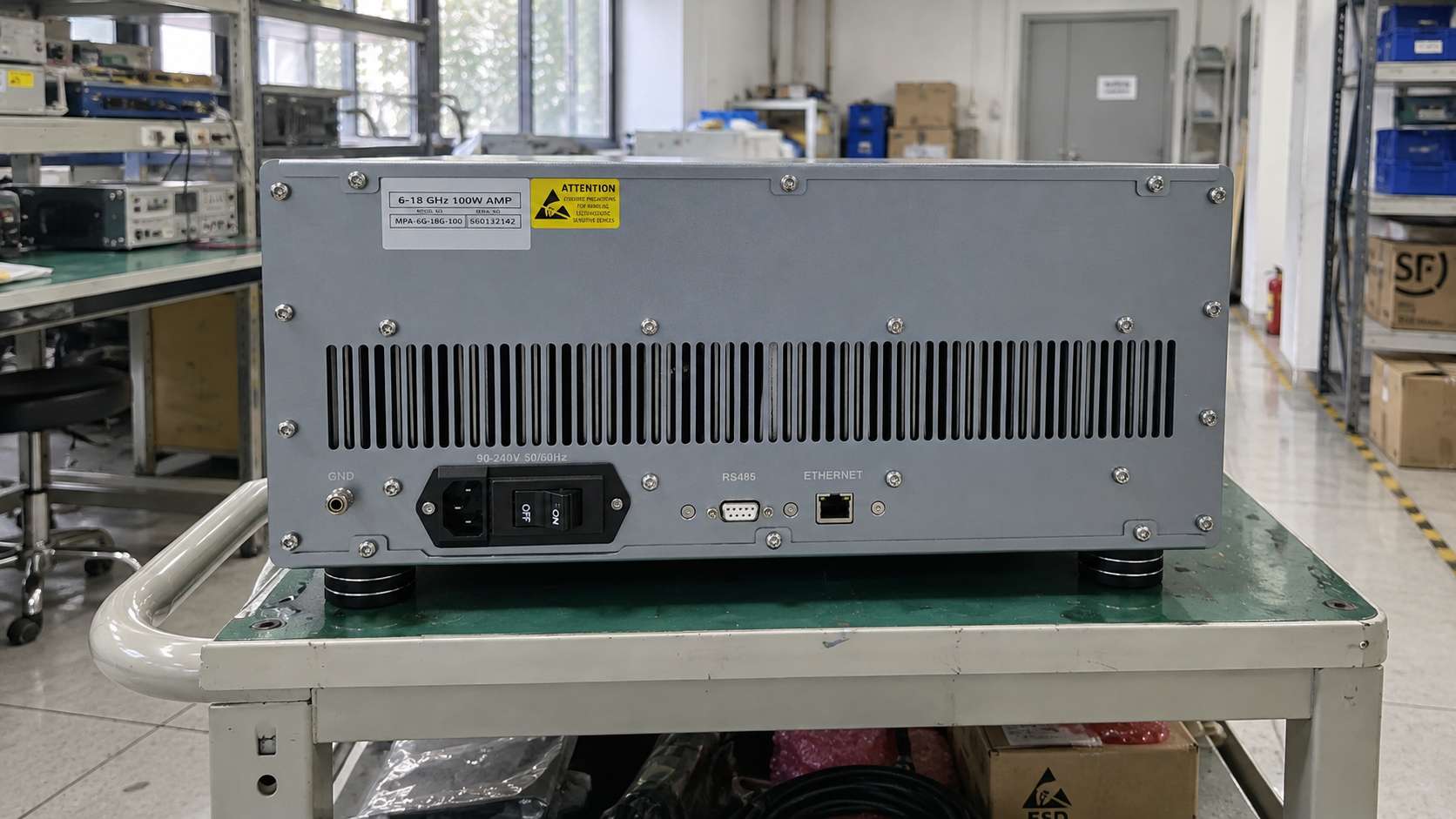 Rear ventilation slots and control interfaces of a rack power amplifier with clear space behind the chassis