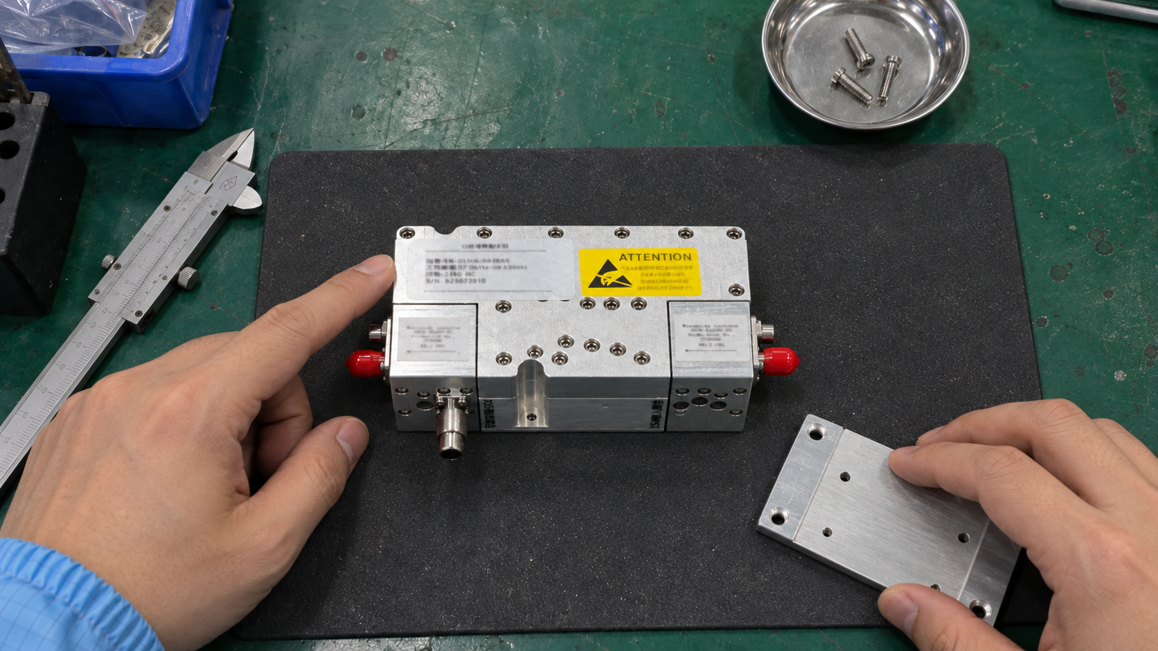 Overhead view of a low noise amplifier module and mounting plate during mechanical integration checks
