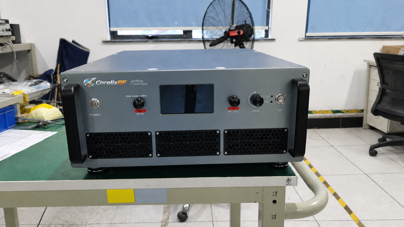 RF amplifier production testing workbench with a rack-mounted amplifier.