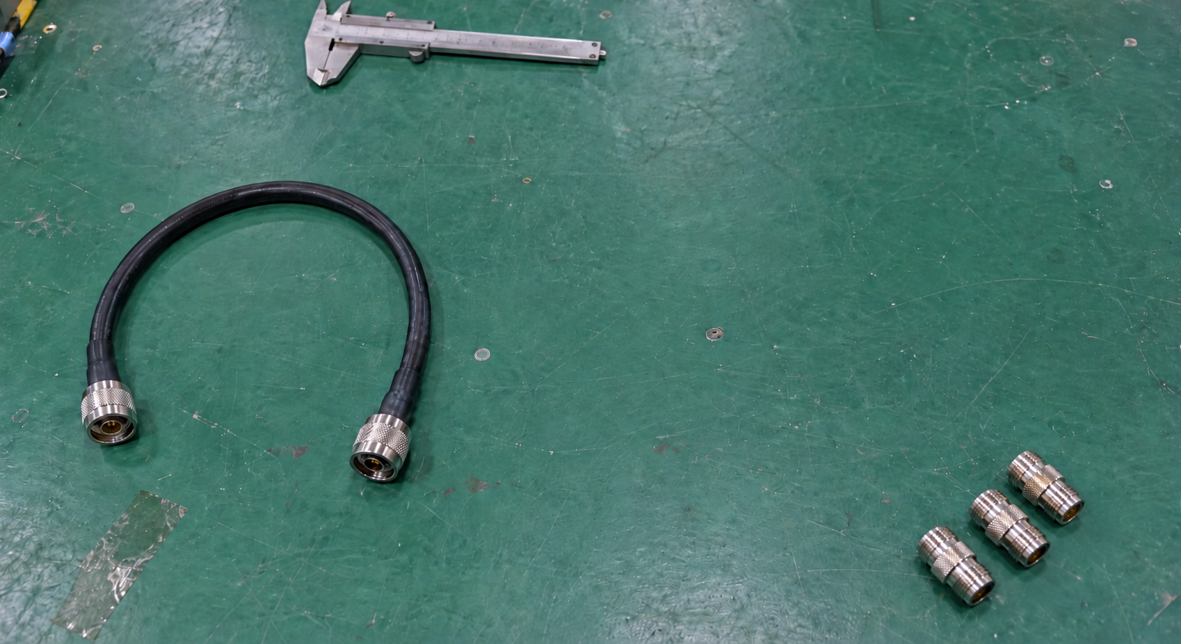 Short coaxial cable assembly and three separate adapters laid out for RF branch planning
